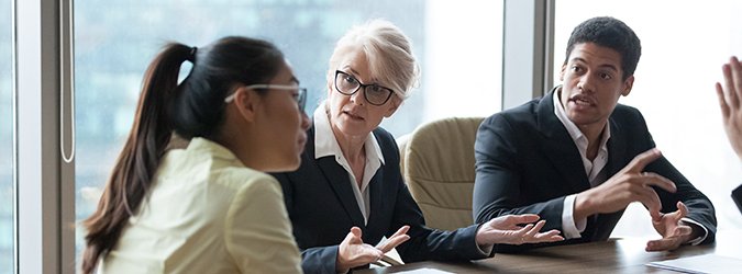 Employees dispute accusing colleague during company meeting