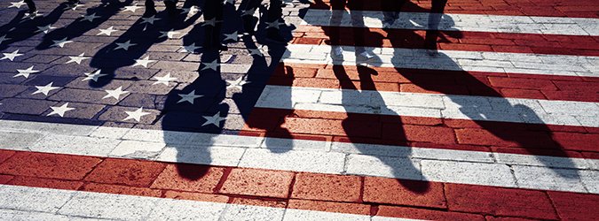 Group of people walking with painted usa flag